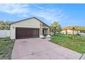 One-story house with attached garage and front yard at 7022 Arbor View Ln, New Port Richey, FL 34653