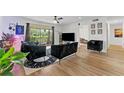 Living room with wood flooring and black velvet furniture at 4026 Cortez Dr # D, Tampa, FL 33614