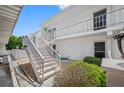 Exterior view of building, showing stairs and landscaping at 1655 S Highland Ave # E223, Clearwater, FL 33756