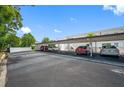 Covered parking area with several cars parked underneath at 1655 S Highland Ave # E223, Clearwater, FL 33756