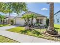 House exterior with a two-car garage at 11314 Misty Isle Ln, Riverview, FL 33579