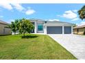 Beautiful two-story home with three-car garage and paver driveway at 5217 Forbes Ter, Port Charlotte, FL 33981