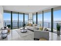 Modern living room with floor-to-ceiling windows and water views at 2912 W Santiago St # 2104, Tampa, FL 33629