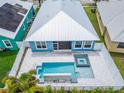 Aerial view showing home, pool, and surrounding neighborhood at 567 Bimini Bay Blvd, Apollo Beach, FL 33572