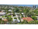 Stunning aerial view of a charming neighborhood with lush landscaping, close to the ocean and intercoastal waterways at 608 Armada S Rd, Venice, FL 34285
