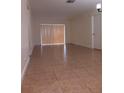 Large living room with tile floors and sliding doors at 4606 W Gray St # 110, Tampa, FL 33609
