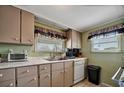 Efficient kitchen with light-colored cabinets, stainless steel sink, and modern appliances at 122 E Saint Annes Cir, Apollo Beach, FL 33572