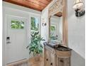 Bright entryway with a console table and mirror at 608 Armada S Rd, Venice, FL 34285