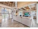 Spacious living room with high ceilings and exposed beams at 2118 Harbour Watch Dr, Tarpon Springs, FL 34689