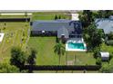 Aerial view of house with a fenced backyard and swimming pool at 1034 S Mount Carmel Rd, Brandon, FL 33511