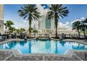 Beautiful pool area with palm trees and an elegant design, offering a luxurious and relaxing outdoor space at 700 S Harbour Island Blvd # 722, Tampa, FL 33602