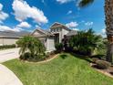 Spacious three-car garage home with curb appeal at 11432 Drifting Leaf Dr, Riverview, FL 33579