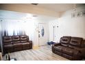 Living room with brown leather couches and light floors at 2503 W Marquette Ave, Tampa, FL 33614