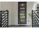 Modern front door with glass panels and black metal accents at 321 W Hanlon St, Tampa, FL 33604