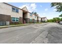 Side view of a two-story apartment building with brick and stucco at 9009 Westchester Cir # B-18, Tampa, FL 33604