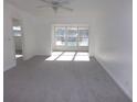 Spacious bedroom with carpet and large window at 1433 S Belcher Rd # A9, Clearwater, FL 33764