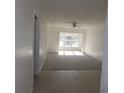 Bright living room with carpet and tile floors at 1433 S Belcher Rd # A9, Clearwater, FL 33764