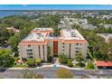 Aerial view of condo building with water views at 2630 Pearce Dr # 404, Clearwater, FL 33764