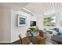 Open living room with modern furniture and large window at 2331 W Horatio St # 610, Tampa, FL 33609