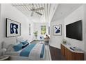 Spacious bedroom with a bed, TV, and work area at 2331 W Horatio St # 610, Tampa, FL 33609
