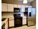 Kitchen with stainless steel appliances and light wood cabinets at 6410 Cypressdale Dr # 201, Riverview, FL 33578