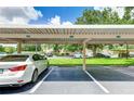 Covered parking spot available for residents in a well-lit area at 5134 Northridge Rd # 309, Sarasota, FL 34238