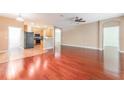 Open living and kitchen area with hardwood floors at 10741 Rockledge View Dr, Riverview, FL 33579