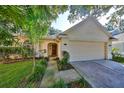 Charming single-story house with attached garage and well-manicured lawn at 17721 Ridgeway Point Pl, Tampa, FL 33647