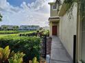 Townhome with a red door and a landscaped walkway at 11074 Winter Crest Dr, Riverview, FL 33569