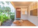 Inviting front door entrance with a wooden deck at 1837 Worrington St, Sarasota, FL 34231