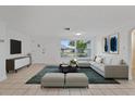 Spacious living room featuring a comfortable sectional sofa at 1332 Maybury Dr, Holiday, FL 34691