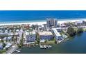 Aerial view of a condo building near the beach and waterway at 3805 Gulf Blvd # 205, St Pete Beach, FL 33706