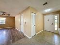 Bright and airy entryway with tile flooring and access to living areas at 7702 Ivory Ter, New Port Richey, FL 34655