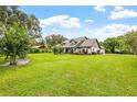 Large home with spacious green yard at 1810 S Valrico Rd, Valrico, FL 33596