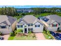 Luxury home with solar panels and a landscaped yard at 10813 Rolling Moss Rd, Tampa, FL 33647