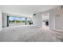 Spacious living room with large windows and view at 1655 S Highland Ave # J390, Clearwater, FL 33756