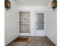 Condo entryway with two doors and a welcome mat at 1655 S Highland Ave # J390, Clearwater, FL 33756