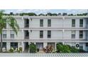 Condo building exterior with balconies and lush landscaping at 1655 S Highland Ave # J390, Clearwater, FL 33756