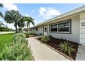 Updated ranch home with walkway and landscaping at 5805 8Th Avenue W Dr, Bradenton, FL 34209