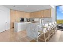 Bright and spacious kitchen with an island, sleek cabinets, stainless appliances, and breakfast bar at 2912 Santiago St # 1201, Tampa, FL 33629