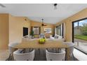 Bright dining area with large table and access to backyard at 15635 Bear Creek Dr, Tampa, FL 33624