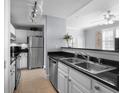 Modern kitchen with stainless steel appliances and granite countertops at 501 Knights Run Ave # 2120, Tampa, FL 33602