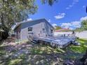 Backyard showcases a spacious wooden deck, perfect for outdoor entertaining and relaxation at 4477 67Th N St, St Petersburg, FL 33709