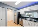 Modern kitchen with stainless steel appliances and white cabinets at 19029 Us Highway 19 N # 6-19, Clearwater, FL 33764
