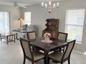 Open concept living and dining areas with tile floors, comfortable seating and natural light at 120 Knollpoint Dr, Sun City Center, FL 33573