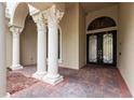 Elegant entryway with columns and double doors at 24155 Hideout Trl, Land O Lakes, FL 34639