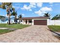 Attractive single story home with paver driveway and lush landscaping at 537 Dolphin Se Ave, St Petersburg, FL 33705
