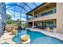 Screened pool area with waterfall, slide and outdoor kitchen at 2924 Valencia Ridge St, Valrico, FL 33596