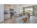 Modern kitchen with stainless steel appliances and granite countertops at 708 160Th E Ln, Bradenton, FL 34212