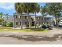 Gray condo building with parking and landscaping at 3822 Cortez Dr # D, Tampa, FL 33614